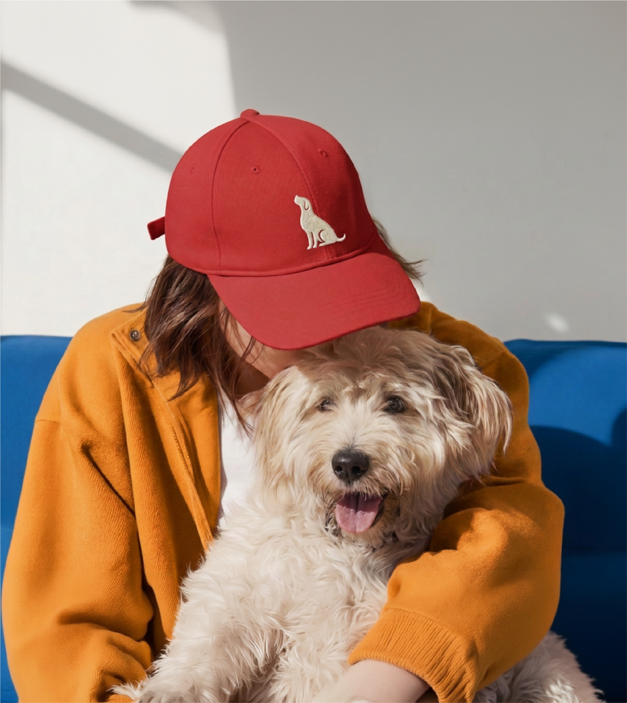 Red cap embroidered with the AKC dog mark