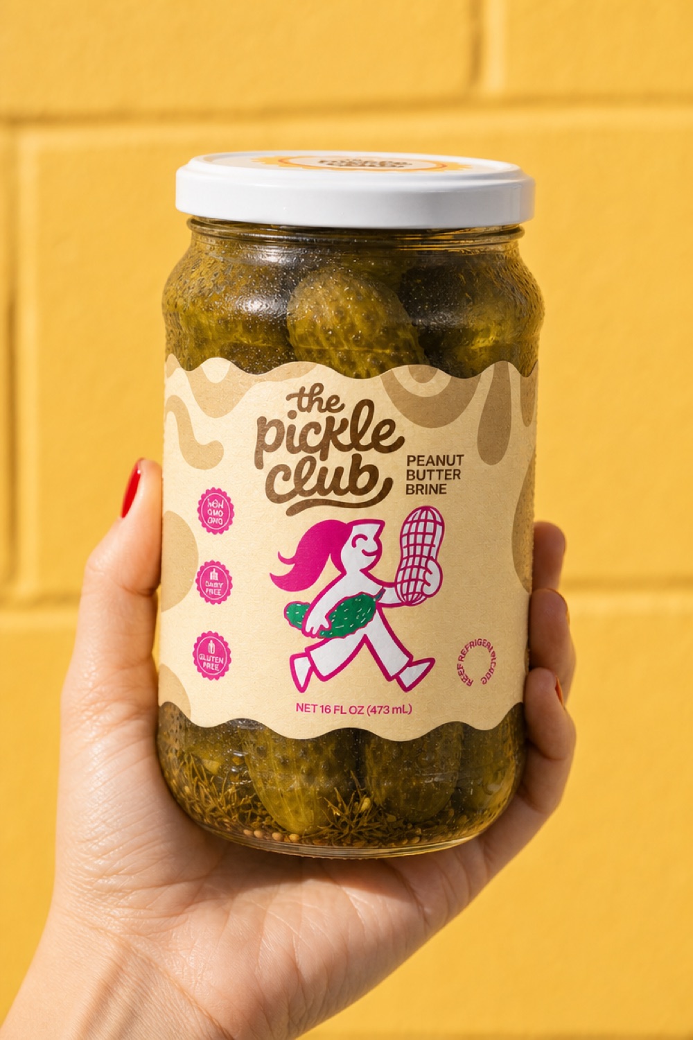 Peanut butter brine Pickle Club jar on yellow