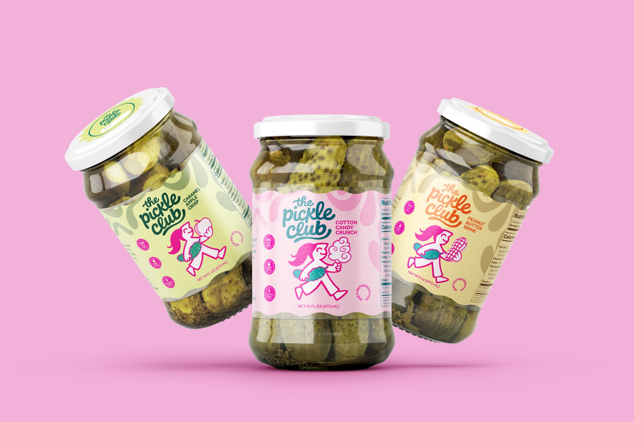 Three Pickle Club jars arranged on a pink background
