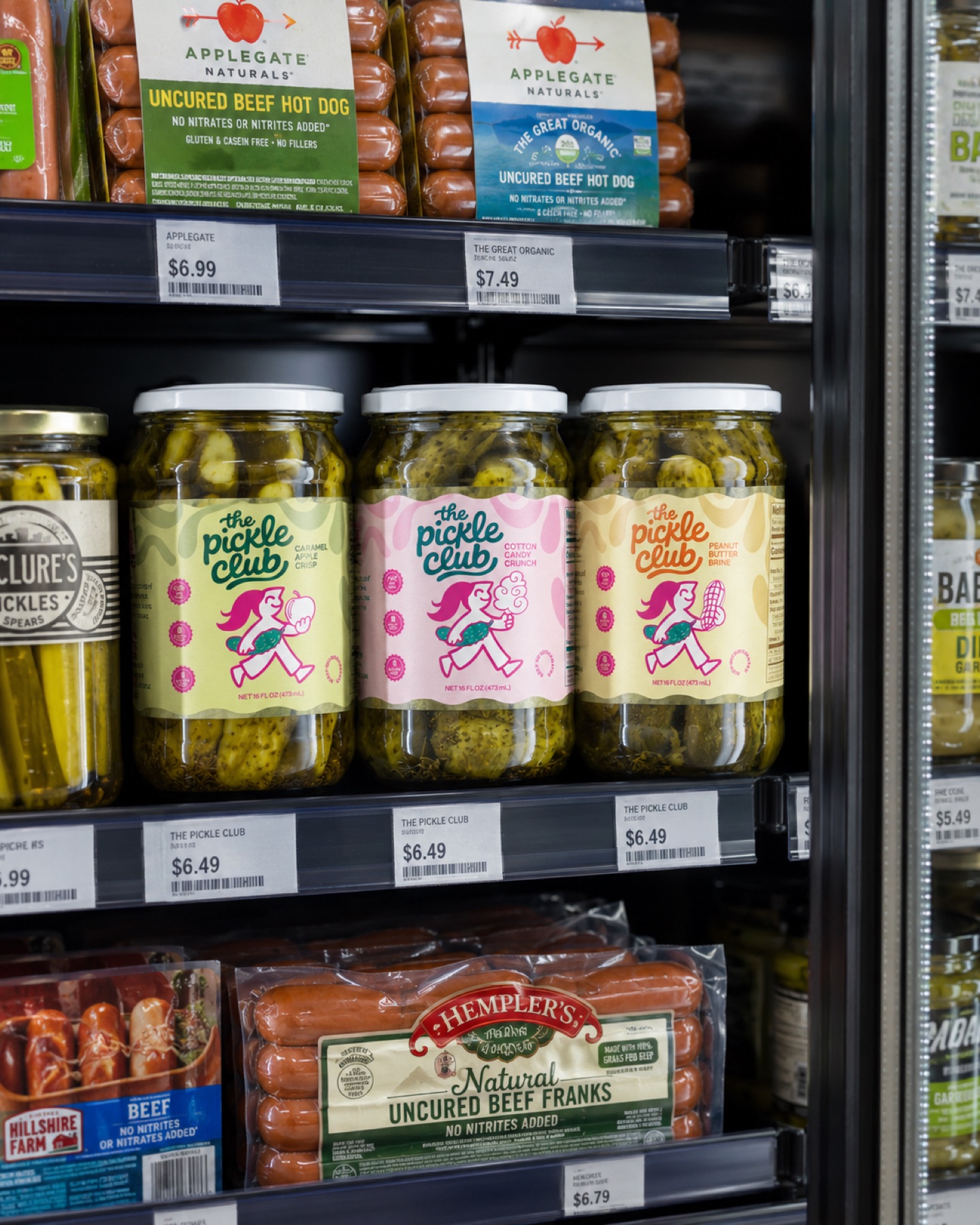 The Pickle Club jars displayed on a grocery shelf